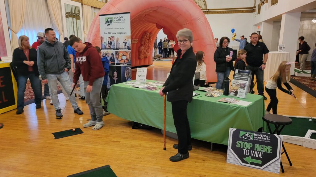 A sponsor interacting with guests with a contest for a prize