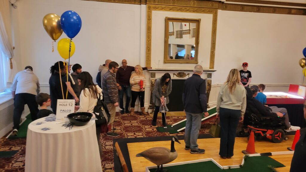 A view of people golfing and socializing