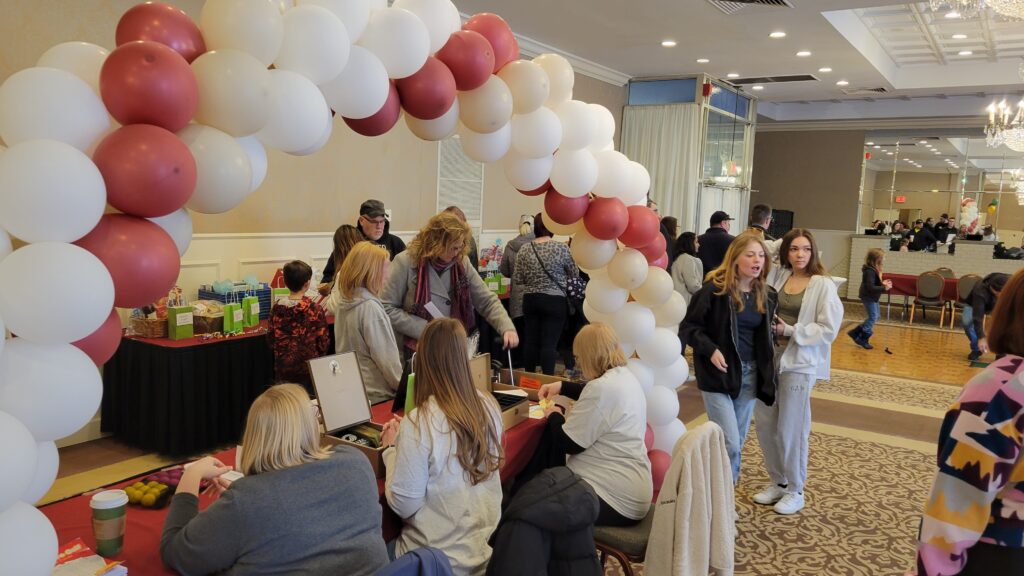 People walking around the prize counter